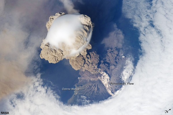 This is a view from space of the eruption of Sarychev volcano.  The plume appears to be a combination of brown ash and white steam. The vigorously rising plume gives the steam a bubble-like appearance.