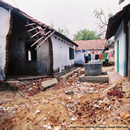 Destroyed houses, a well, and laundry in Sri Lanka after the 2004 
Indian Ocean Tsunami.